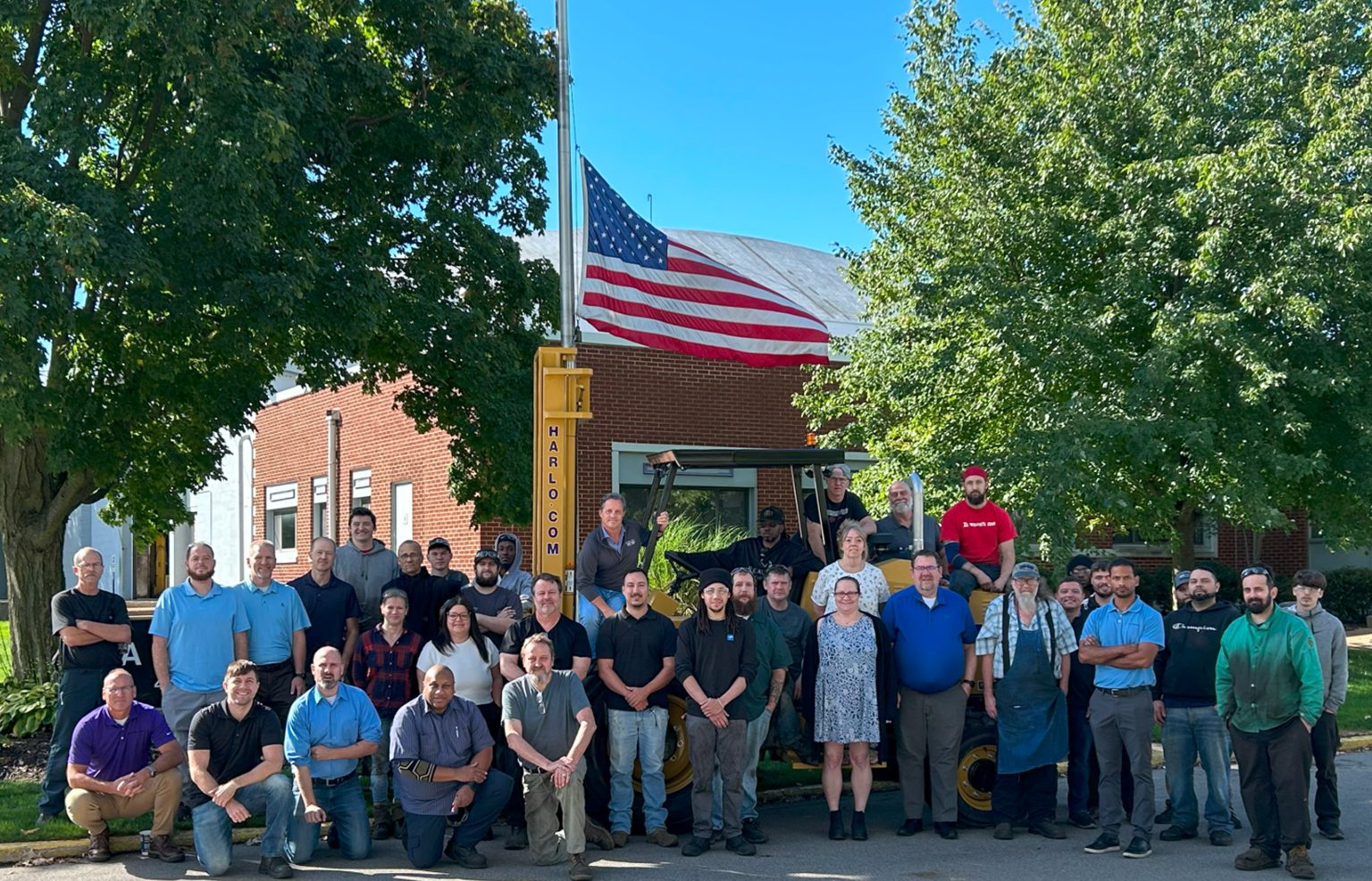 Harlo team members gathered outside the company facility
