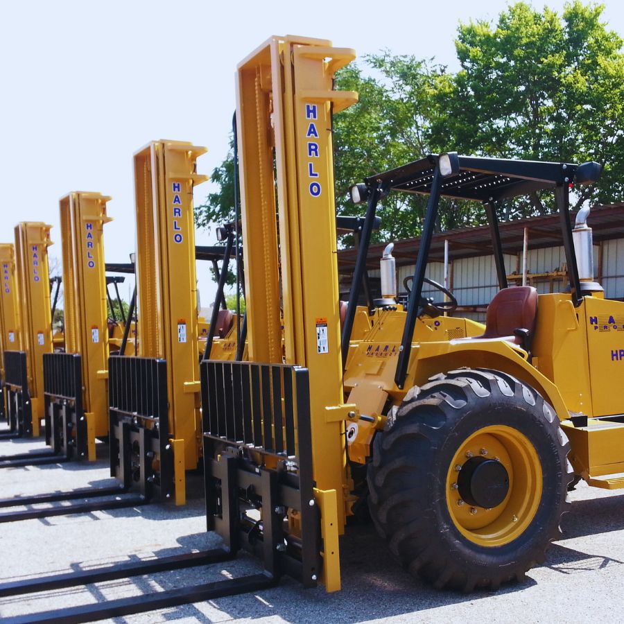 Rental Fleet of Harlo Rough Terrain Forklifts Row of Harlo rough terrain forklifts lined up in a rental yard